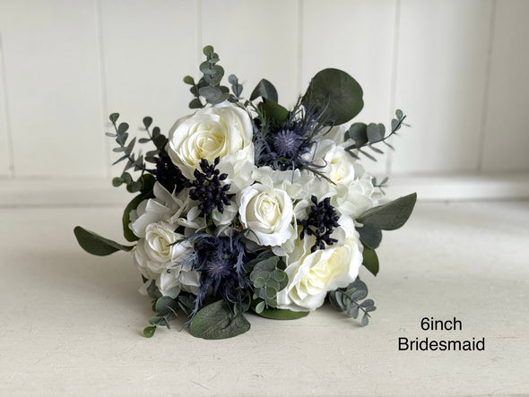 White and navy blue artificial wedding flowers.