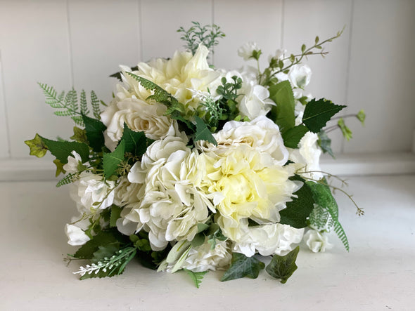 Ivory and green wedding bouquet and matching buttonhole