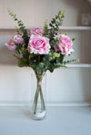 Luxury pink roses and eucalyptus silk flower tied arrangement.
