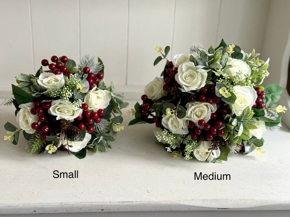 Christmas faux flower tied arrangement. Roses, berries and mixed foliage. *Vase not included