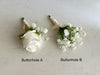 Rose and gyp pin buttonholes for the groom and groomsmen. Artificial baby’s breath buttonholes.