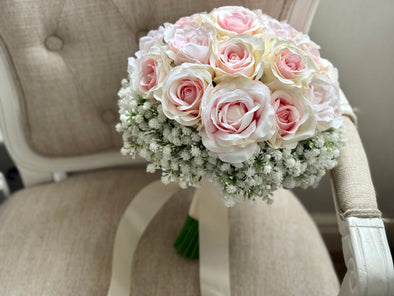 Pretty pale pink and ivory two tone roses and gypsophila wedding flowers.