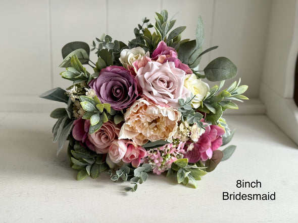 Pink and cream artificial wedding flowers. Roses and peonies.