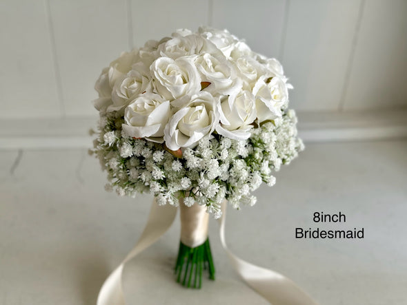 White roses and baby’s breath wedding flowers. Gypsophila bouquets