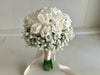 White roses and gypsophila wedding flowers. Baby’s breath bridesmaid bouquet