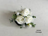 Rustic white and green silk wedding flowers jacket corsage. White roses, gypsophila and eucalyptus. Corsages are usually worn by the mother of the bride and mother of the groom.