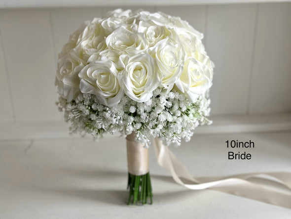 White roses and baby’s breath wedding flowers. Gypsophila bouquets