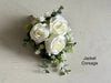 White and sage green artificial wedding flowers. Roses, peonies and gypsophila.