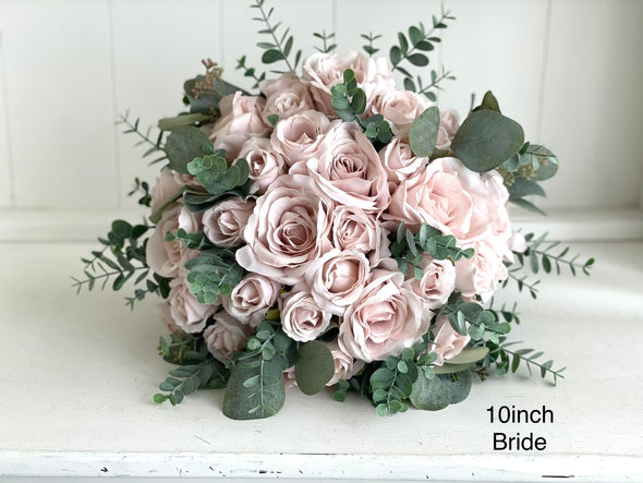 Romantic blush pink wedding flowers with eucalyptus greenery.