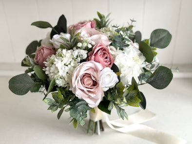 Pink and white artificial wedding flowers. Blush pink and dusky pink roses