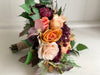 Burgundy, orange and pale peach wedding bouquet and matching buttonhole