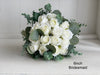 Romantic ivory white wedding flowers with eucalyptus greenery.
