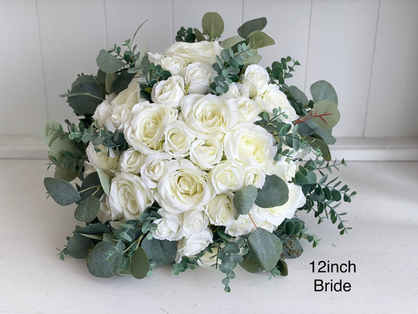 Romantic ivory white wedding flowers with eucalyptus greenery.