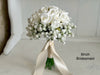 White roses and baby’s breath wedding flowers. Gypsophila bouquets