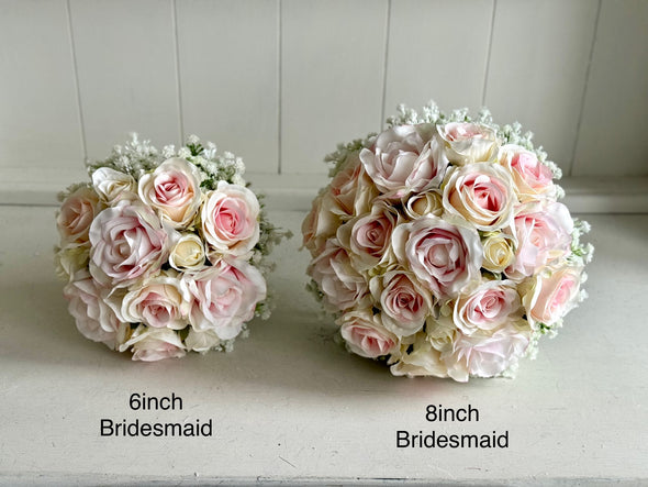 Pretty pale pink and ivory two tone roses and gypsophila wedding flowers.