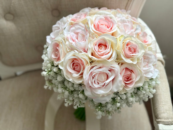 Pretty pale pink and ivory two tone roses and gypsophila wedding flowers.