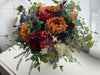 Rustic burnt orange, burgundy and navy blue wedding flowers.