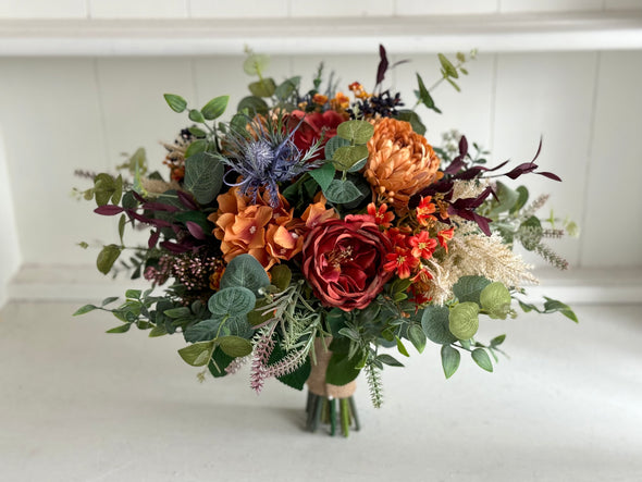 Rustic burnt orange, burgundy and navy blue wedding flowers.