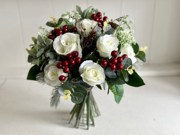 Christmas faux flower tied arrangement. Roses, berries and mixed foliage. *Vase not included