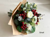 Christmas faux flower tied arrangement. Roses, berries and mixed foliage. *Vase not included