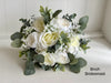 White and sage green artificial wedding flowers. Roses, peonies and gypsophila.