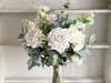 White and green faux flower arrangement