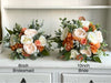 Rustic orange and ivory wedding flowers.