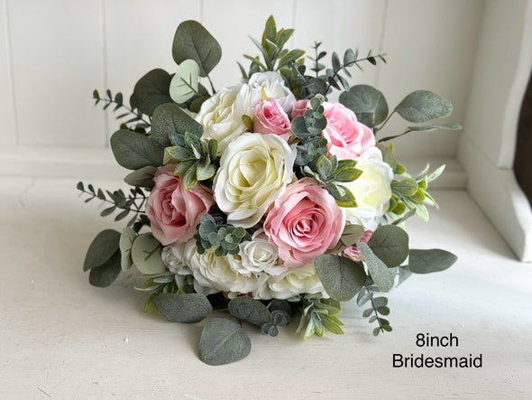 Pale pink and ivory roses silk wedding flowers with eucalyptus and sage greenery. Pink and ivory artificial flowers bridesmaid bouquet.