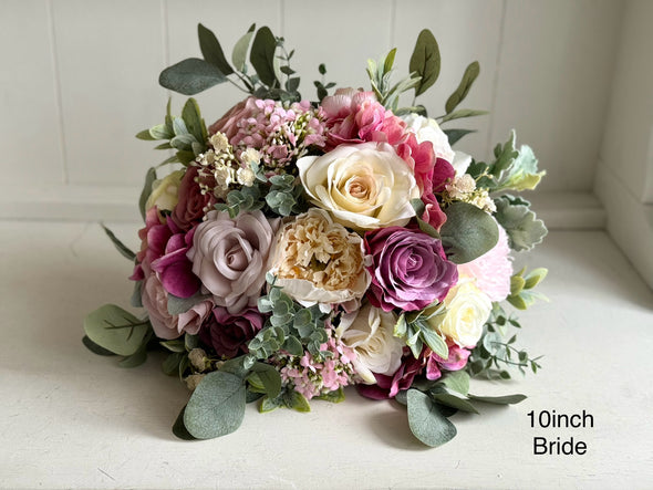 Pink and cream artificial wedding flowers. Roses and peonies.