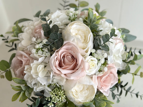 Blush pink and white artificial wedding flowers. Roses and peonies.