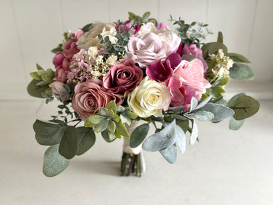 Pink and cream artificial wedding flowers. Roses and peonies.