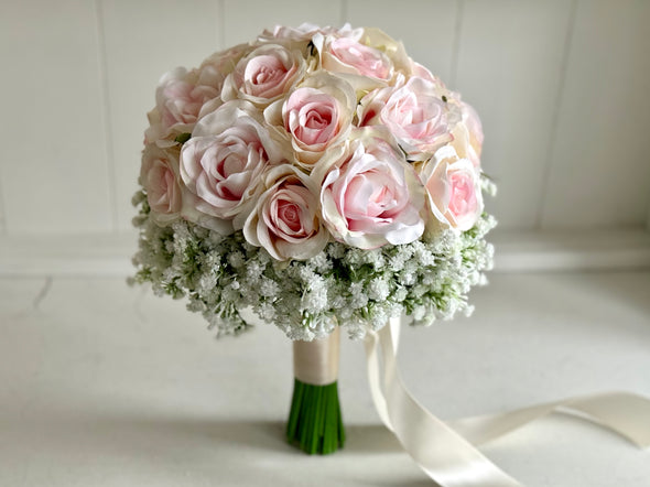 Pretty pale pink and ivory two tone roses and gypsophila wedding flowers.