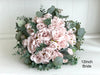 Romantic blush pink wedding flowers with eucalyptus greenery.