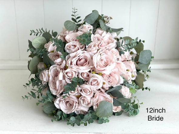 Romantic blush pink wedding flowers with eucalyptus greenery.