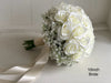 White roses and baby’s breath wedding flowers. Gypsophila bouquets