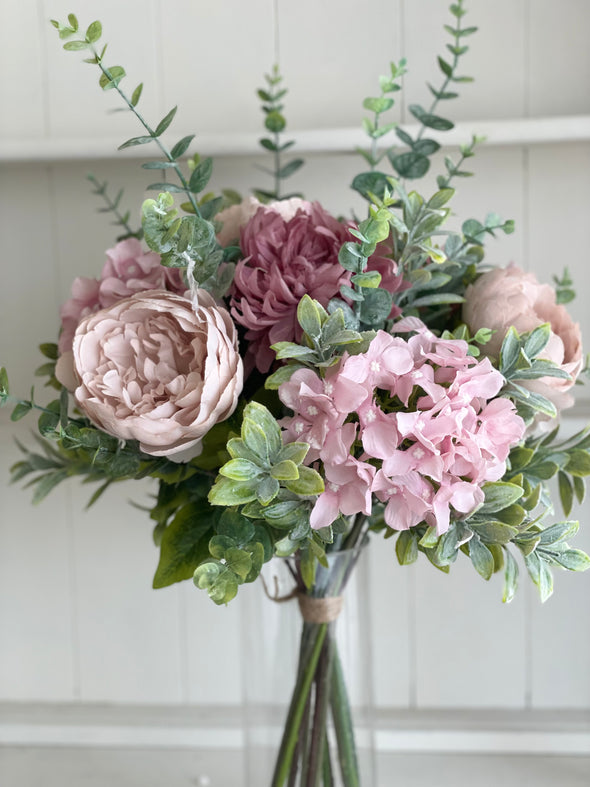 Dusky pink and mauve faux flower arrangement