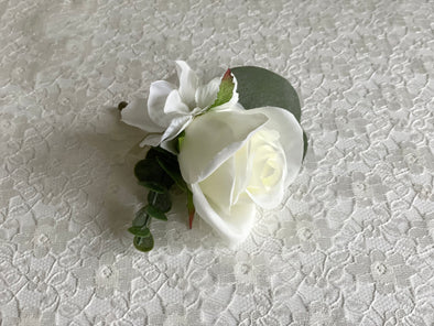 Ivory rose, white hydrangea and eucalyptus wedding buttonhole
