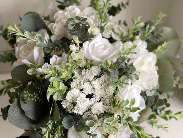 Natural white and green silk wedding flowers with eucalyptus greenery.