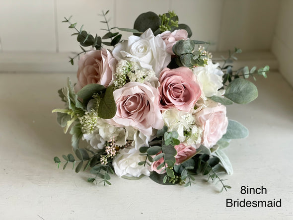 Pink and white artificial wedding flowers. Blush pink and dusky pink roses