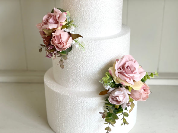 Dusky pink and mauve silk flower cake decoration
