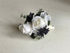 White and navy blue jacket corsage